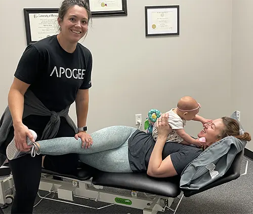 Physical therapist treating a new mom after recently giving birth.